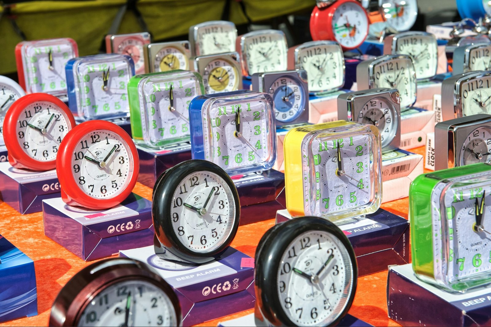 A variety of customizable smart clock faces displayed on multiple screens