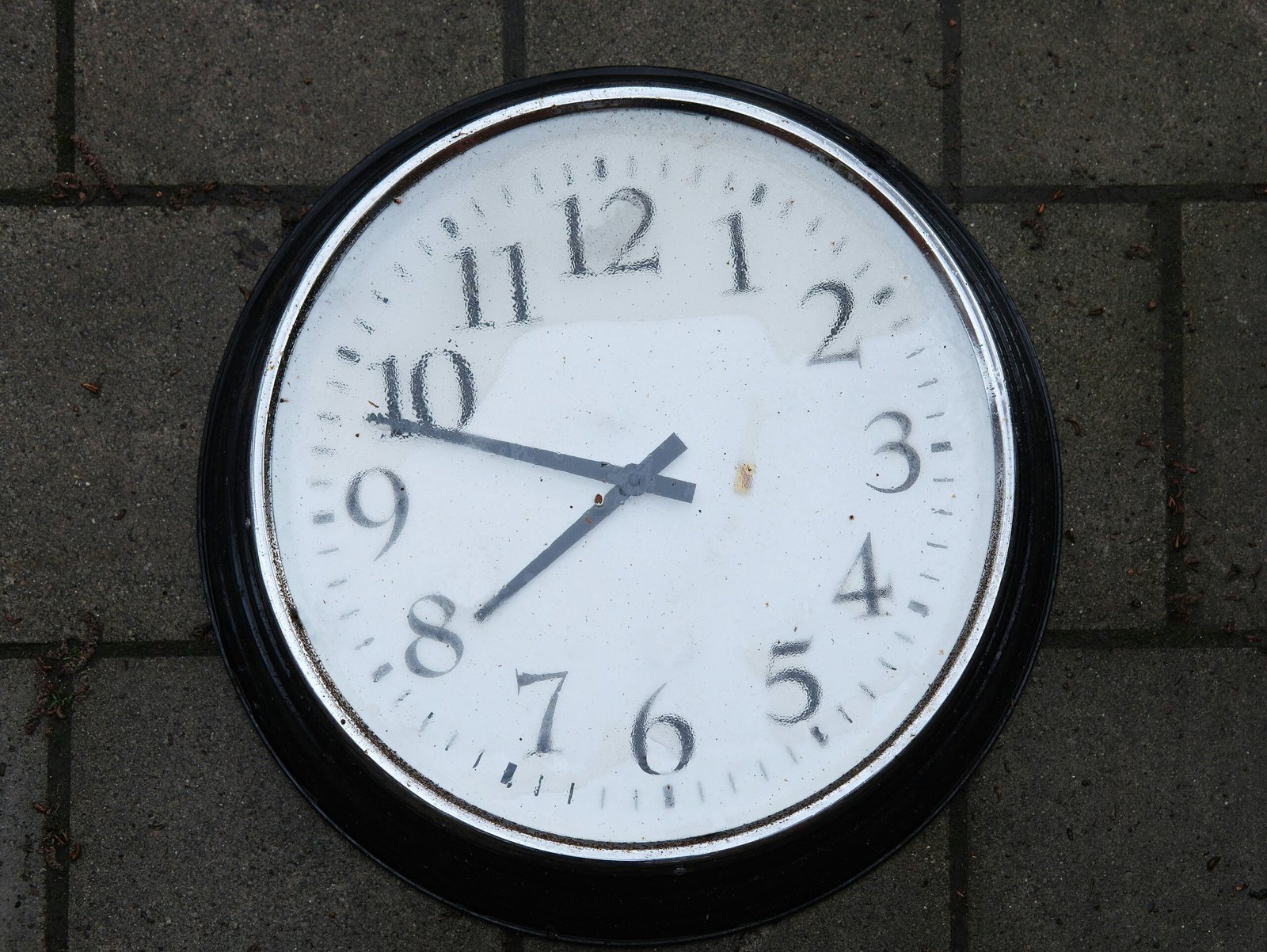 Side-by-side comparison showing sleek design of modern health tracking clock next to an outdated digital clock.
