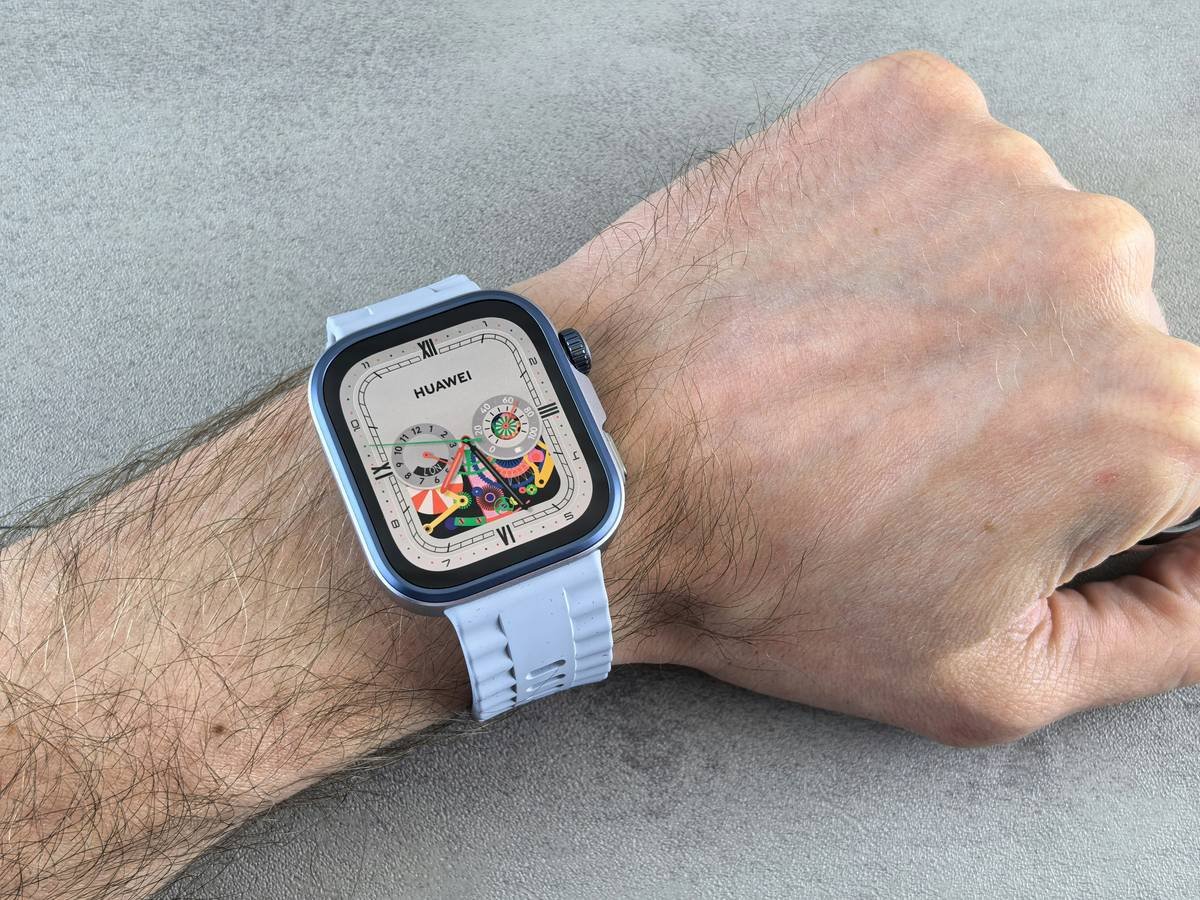 A sleek heart rate clock sitting next to a cup of coffee