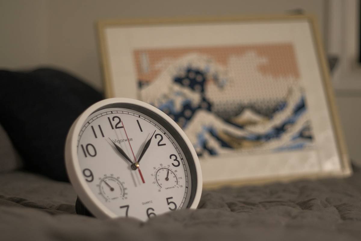 Testimonial image featuring a happy customer with their heart rate clock